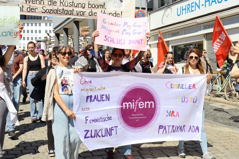 mifem banner at the May Day march